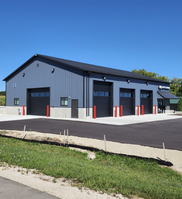 Auto Repair Shop – MW Auto Repair Facility Auto repair shop building with multiple garage bays and service doors
