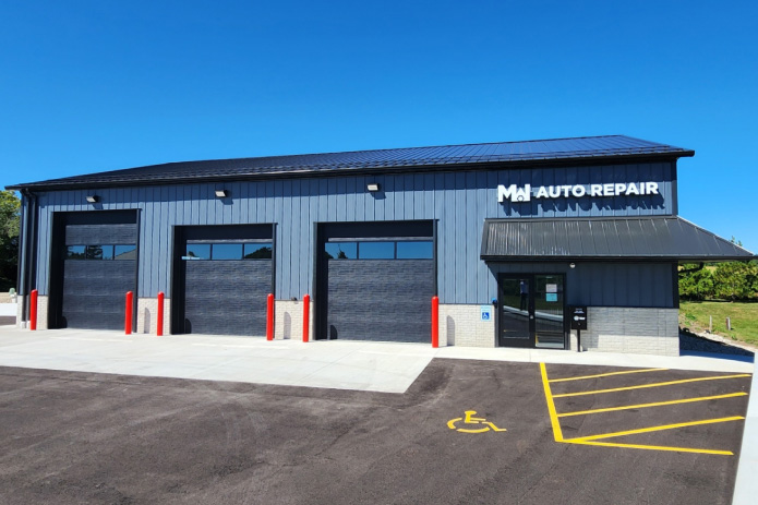 Auto Repair Shop – MW Auto Repair Exterior Front Garage Bay Doors MW Auto Repair building with three service bay doors and storefront entrance