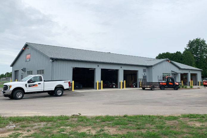 Maintenance garage with multiple service bays and large overhead doors
