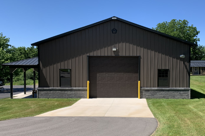Pole Barn Garage Custom Features | Walters Buildings pole barn garage features including drive through doors porch stone wainscot and lighting