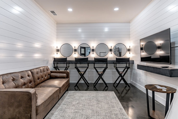 Silo Farms event barn bridal suite with makeup stations, round mirrors, and lounge seating