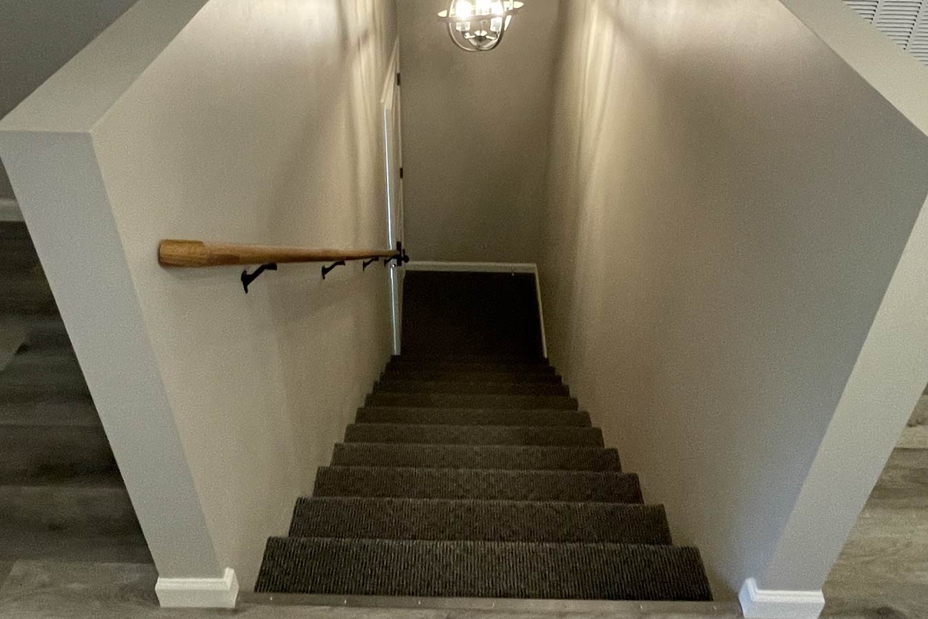 garage with living quarters staircase connecting garage and loft living space