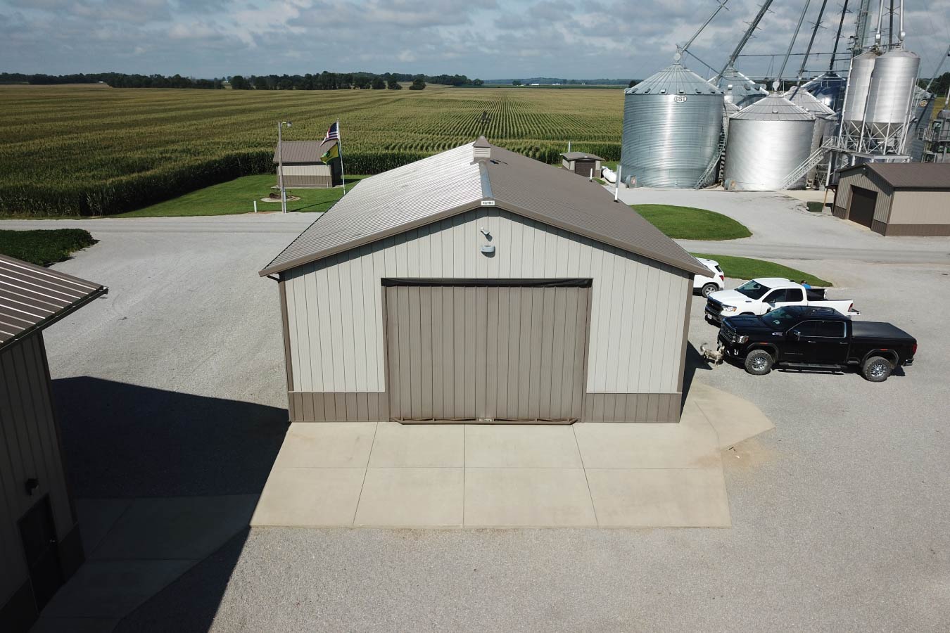 Agricultural pole barn with overhead door used as a storage building on a working grain farm