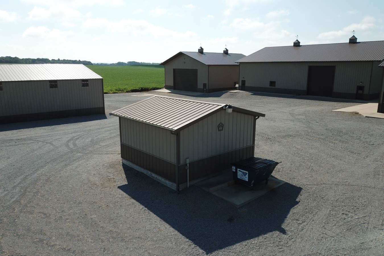 Rear of Small pole barn utility building used for agricultural storage within a grain farm complex