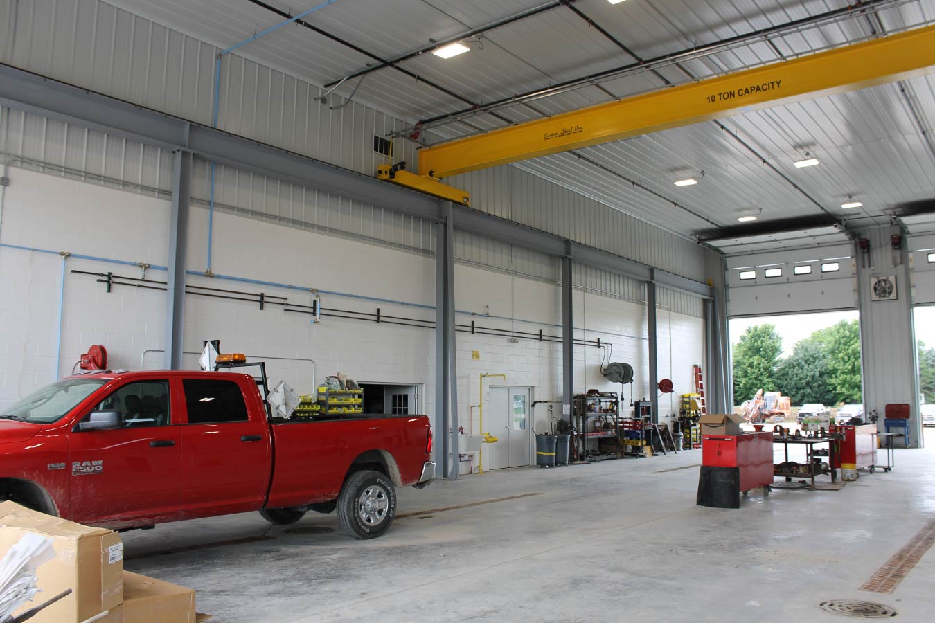 industrial metal building interior with overhead crane large service bay and high clearance shop space