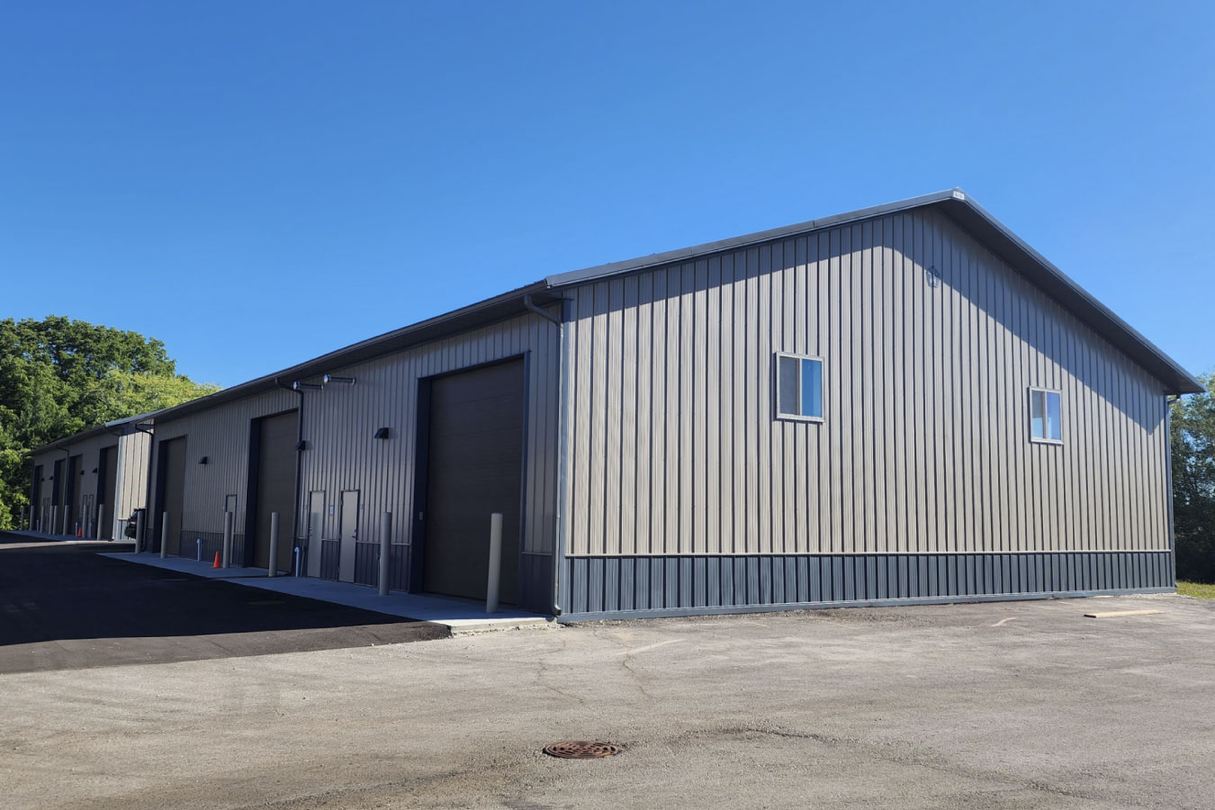 storage condominiums building with steel siding large overhead doors and paved access