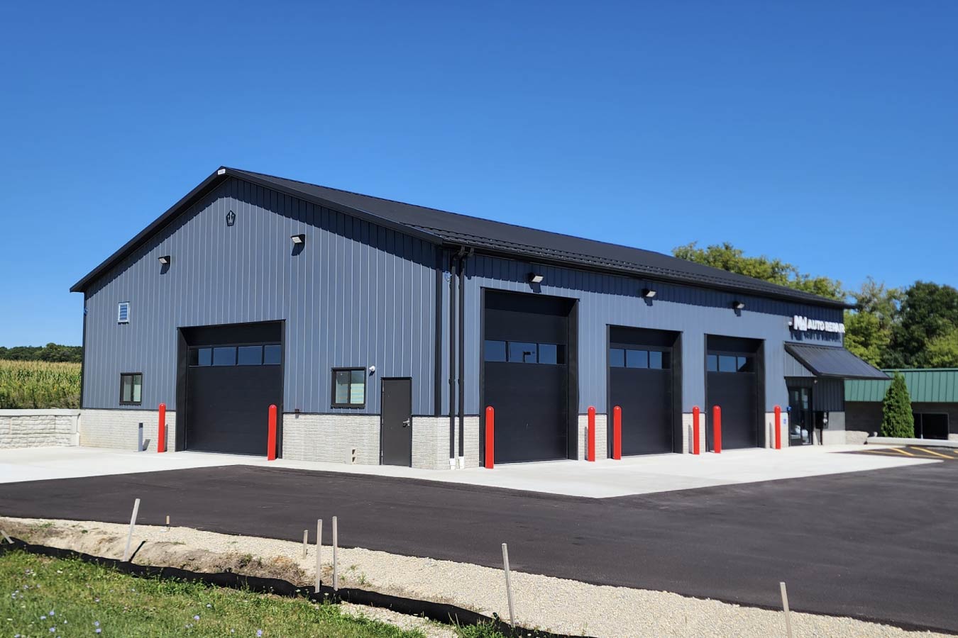 95-1548 MW Auto Repair building with multiple overhead garage doors for vehicle service