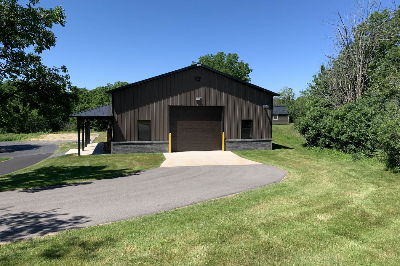 drive through pole barn garage with overhead doors on both ends