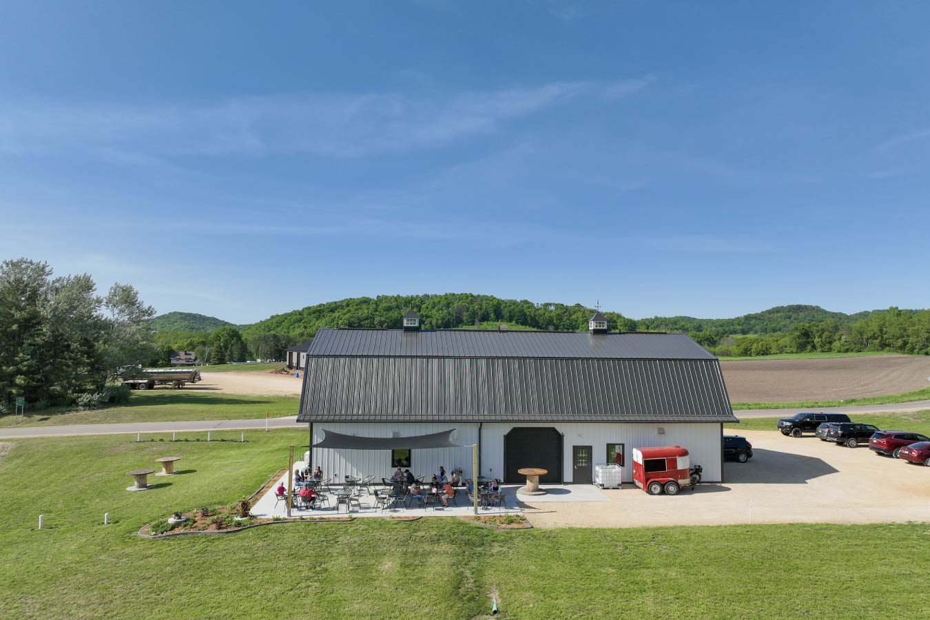 Commercial Building Distillery with Gambrel Roof and Outdoor Patio – Walters Buildings