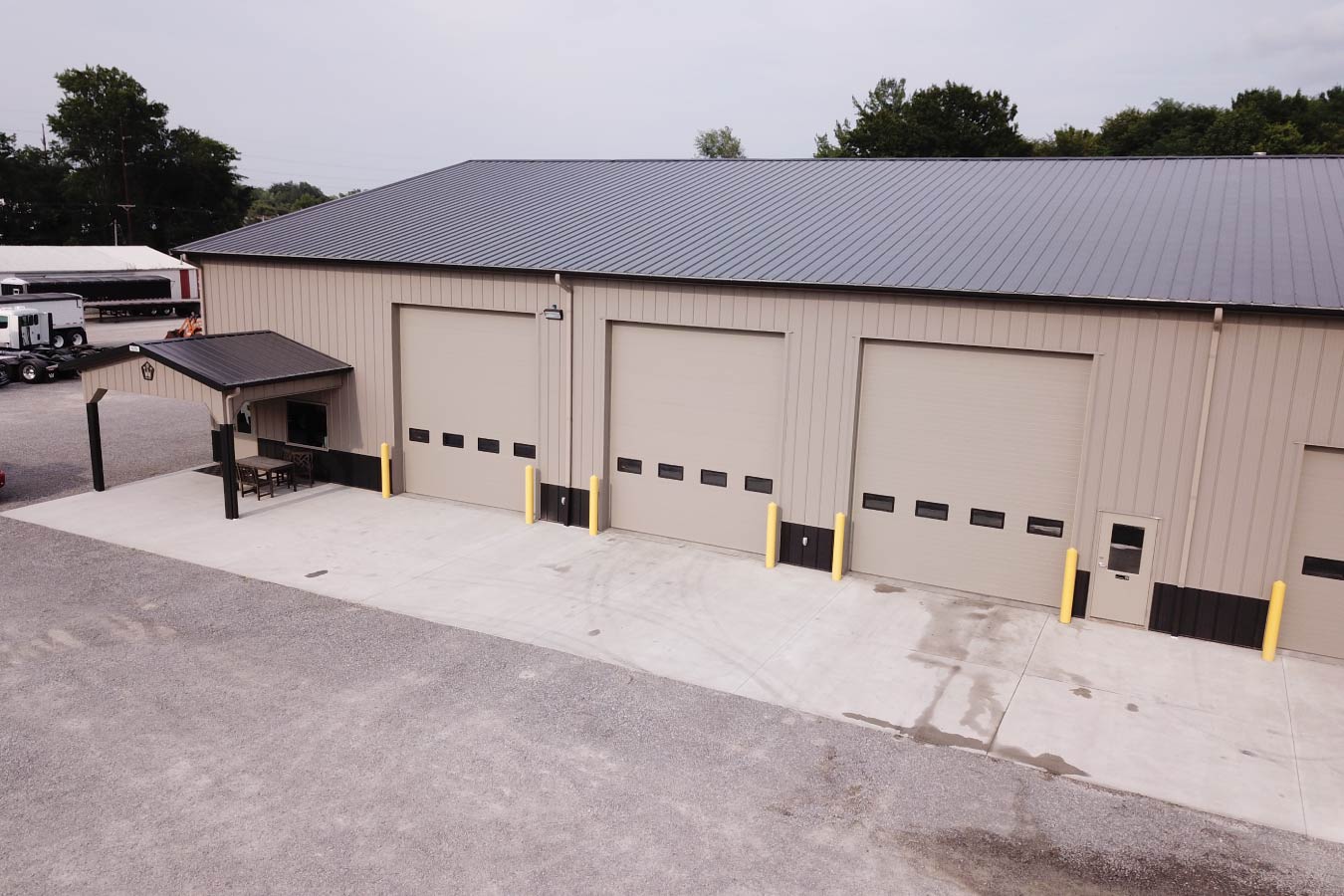 Vaughan Equipment building with multiple overhead service bay doors Rear With Bays Closed