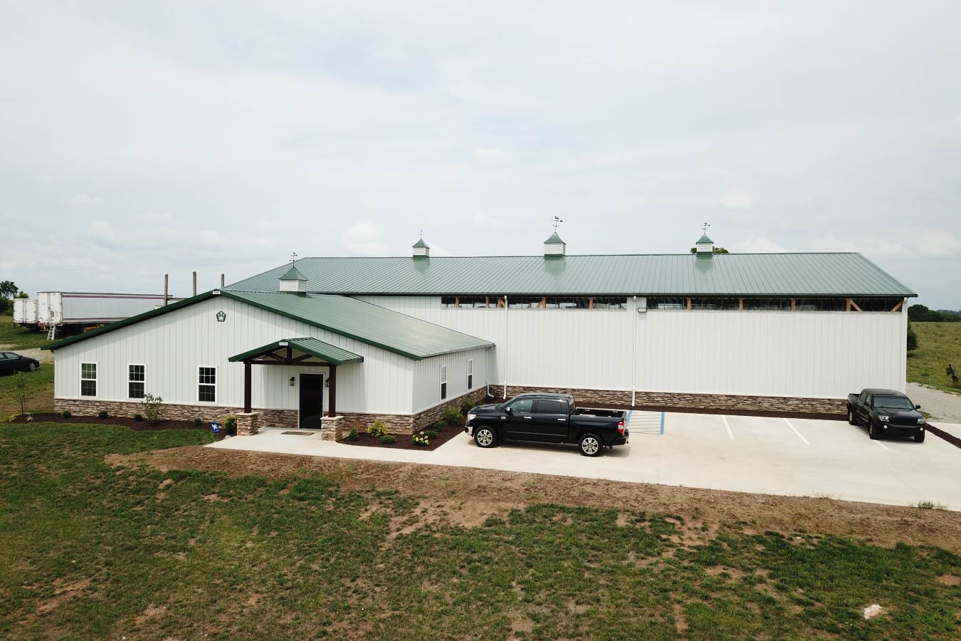 Plumbing warehouse building with attached office and parking area