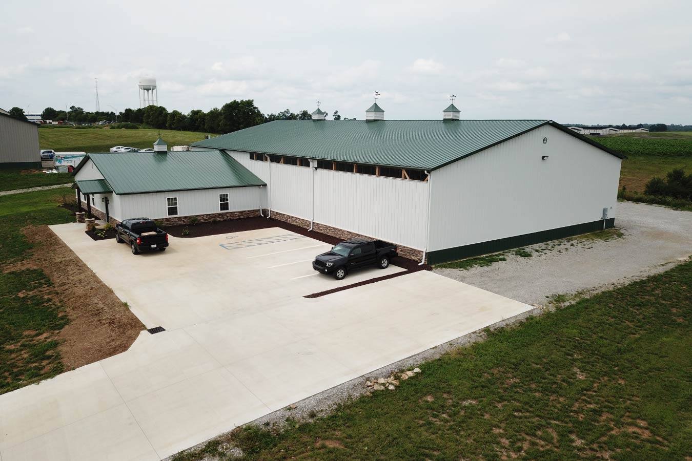 Aerial view of a plumbing warehouse building with office and parking area