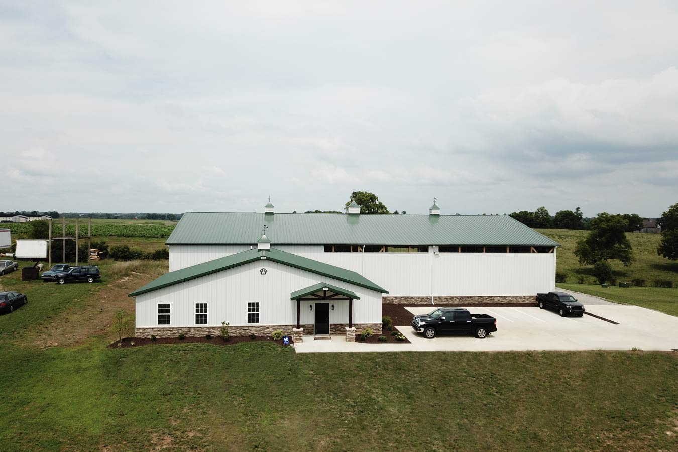Front view of plumbing warehouse with office entrance and warehouse building