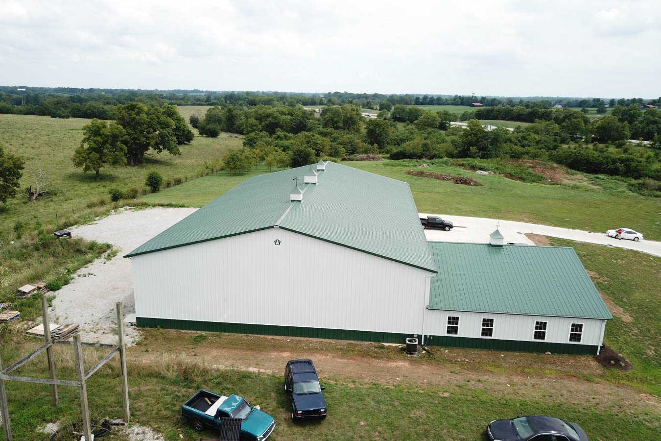 Rear aerial view of plumbing warehouse building with attached office
