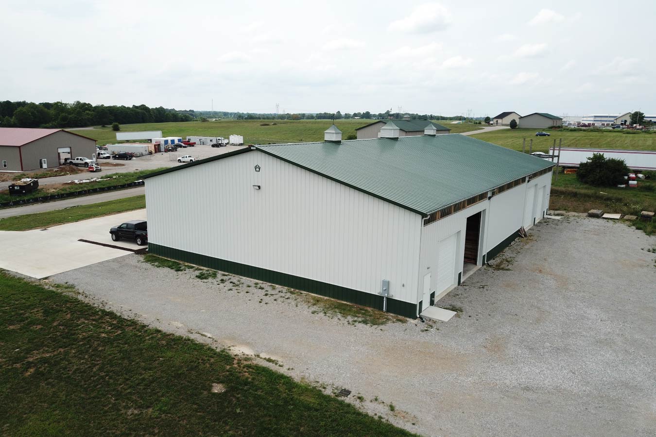 Rear exterior of plumbing warehouse building with loading access