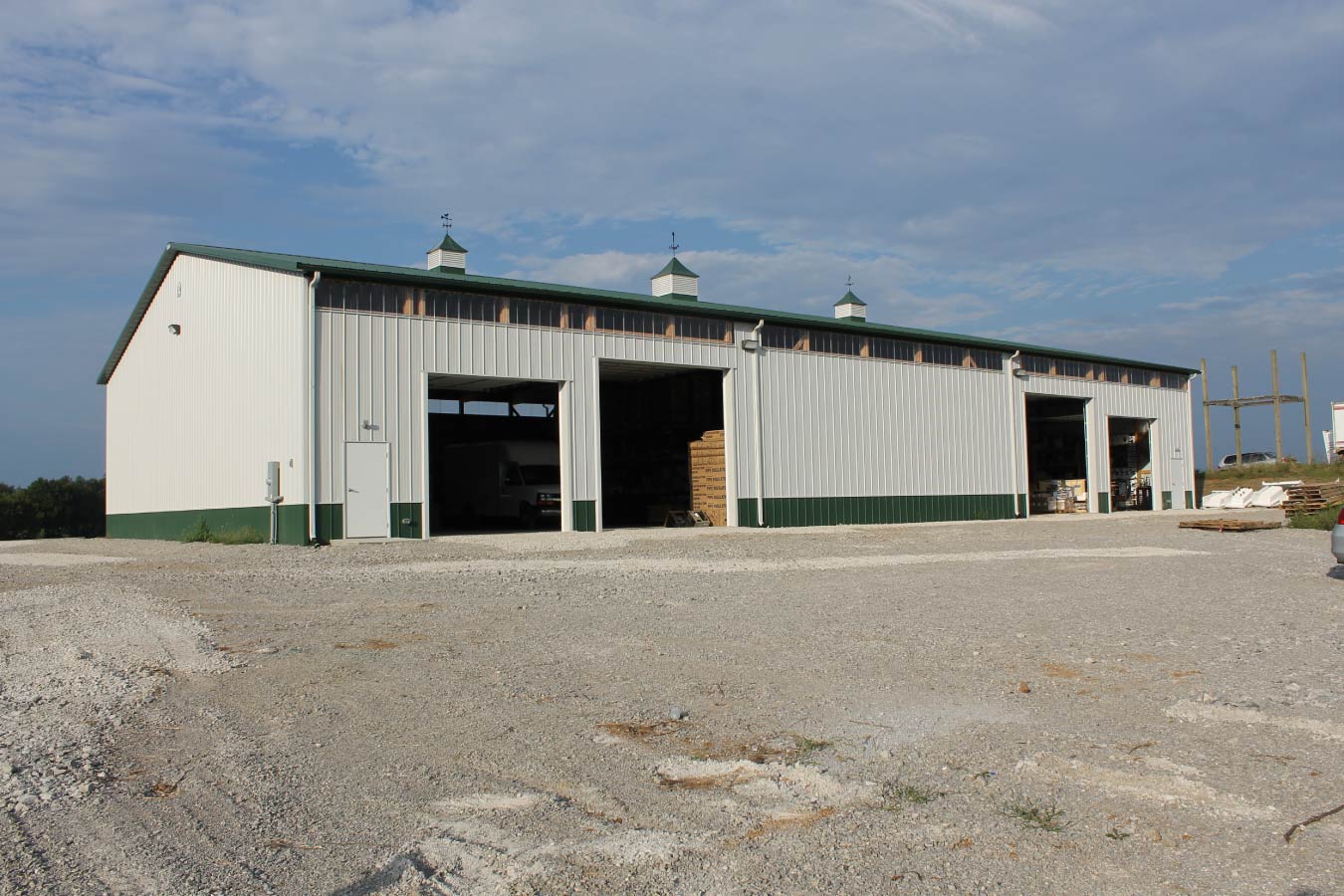 Plumbing warehouse building with large open storage doors