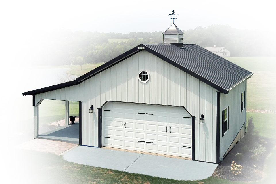 Steel pole barn garage with overhead door, covered porch, cupola, and residential-style windows
