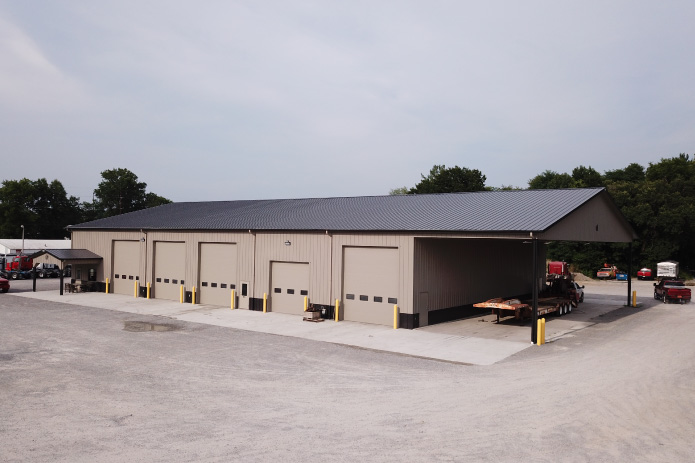 Vaughan Equipment Service Building – Equipment Storage and Maintenance Post-Frame Diesel Repair Shop Vaughan Equipment building with multiple overhead doors and covered equipment bay