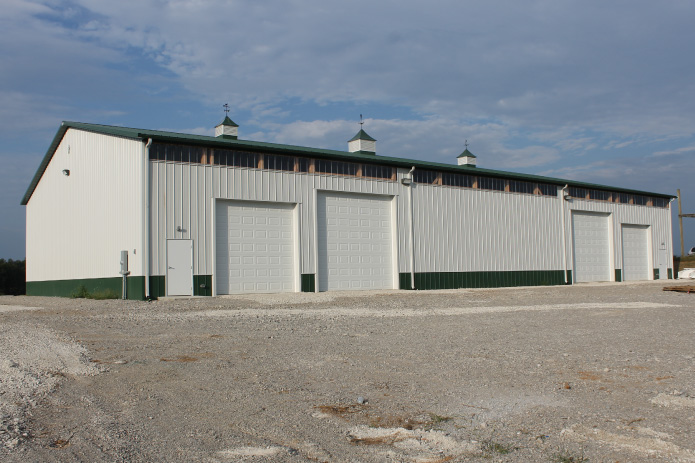 Plumbing Warehouse – Overhead Door Exterior Plumbing warehouse building with multiple overhead garage doors