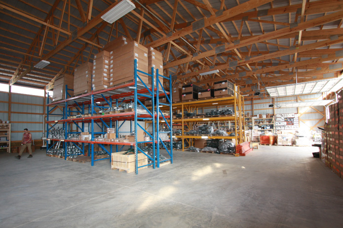 Plumbing Warehouse – Interior Parts Storage Interior of plumbing warehouse with shelving and plumbing inventory