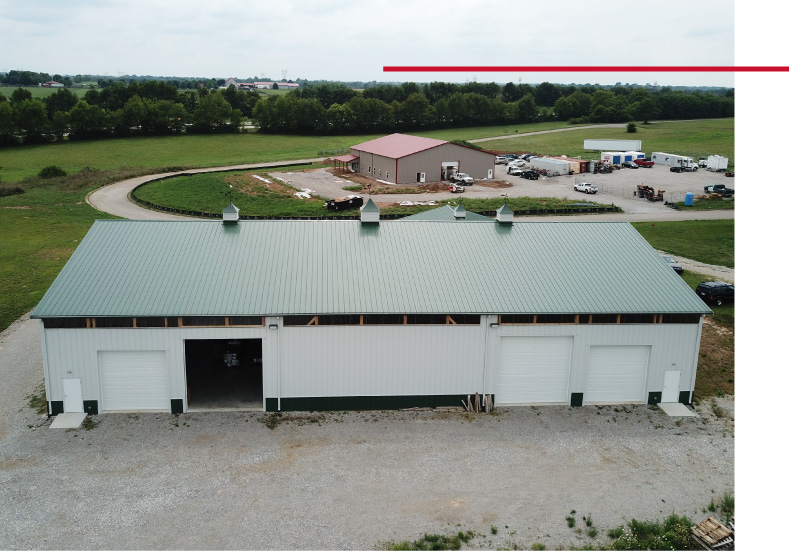 Plumbing Warehouse – Exterior Storage and Distribution Building Large plumbing warehouse building with multiple overhead doors and green roof