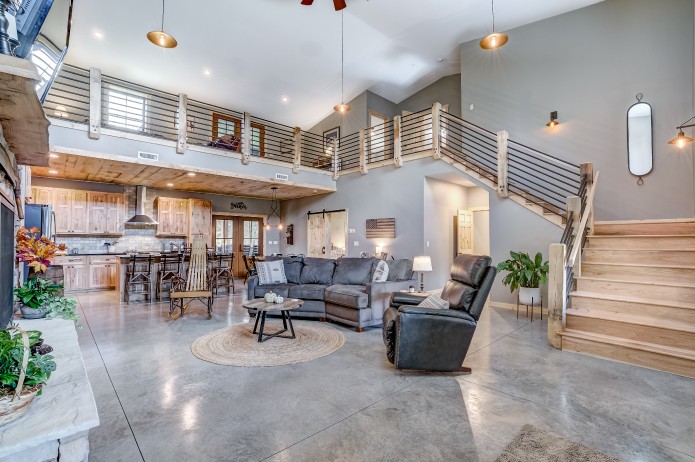 Luxury barndominium open concept living room and loft built by Walters Buildings