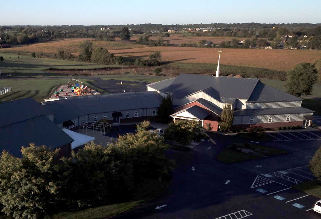 Church Building with Steeple and Community Gathering Space | Walters Buildings Church building with steel siding, steeple, and large gathering space with parking