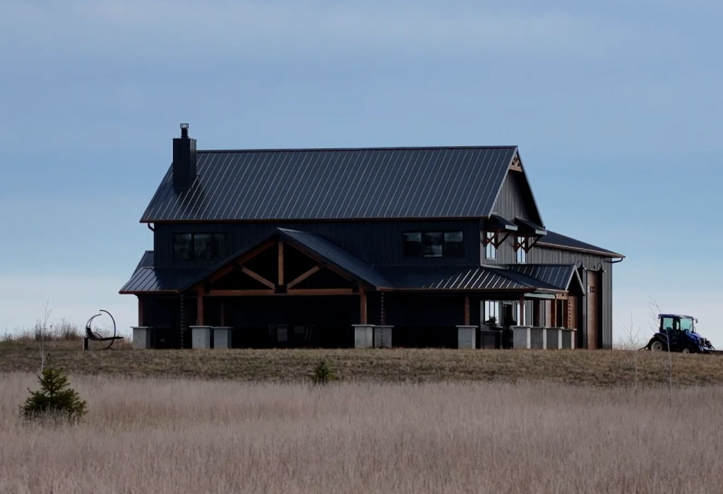 Custom Barndominium Home with Covered Porch | Walters Buildings Custom barndominium with steel siding and covered porch designed for rural residential living