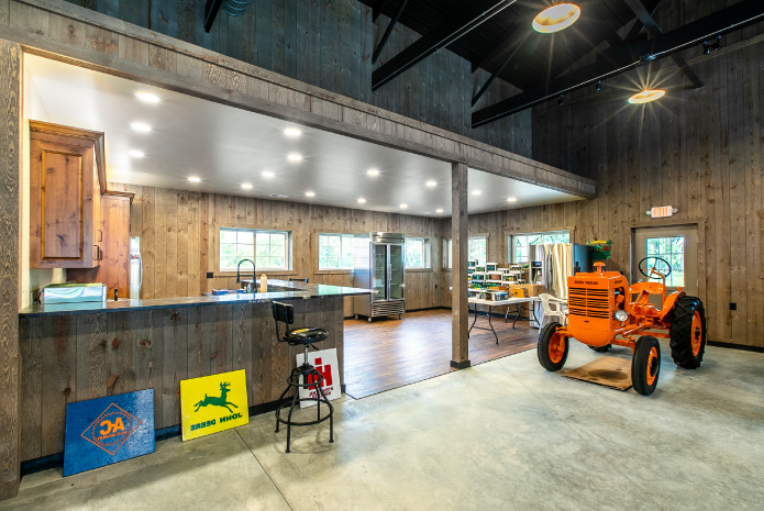 Pole Barn Interior with Rustic Kitchen | Walters Buildings Pole barn interior with rustic kitchen, wood walls, and exposed steel beams