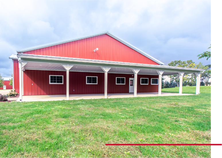 Pole Barn with Full-Length Covered Porch | Walters Buildings Red pole barn with long covered porch, white posts, and metal roof