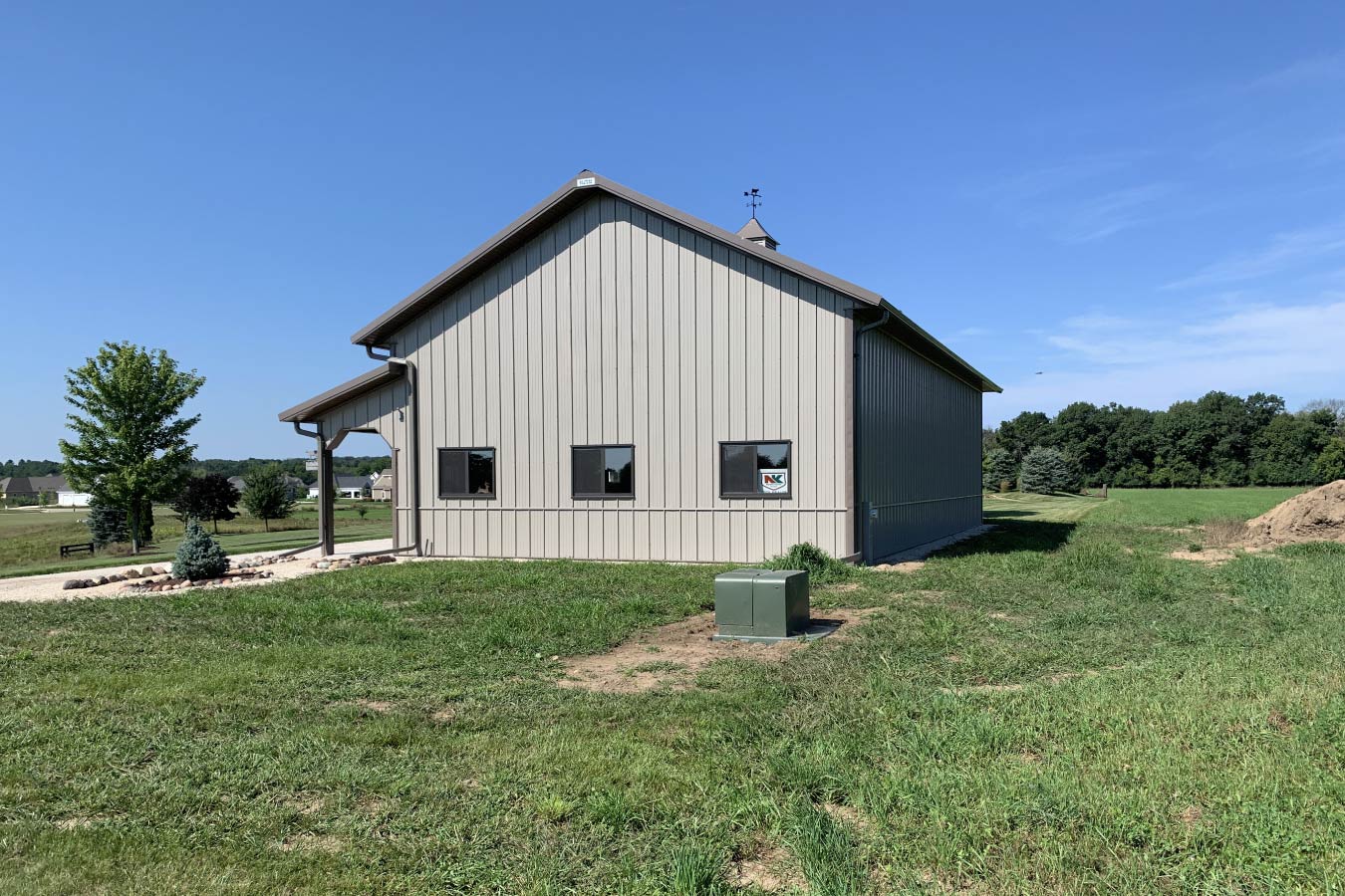 Residential workshop with steel siding, side windows, covered porch, and cupola 4' x 3' Plyco 500 Horizontal Slide Windows