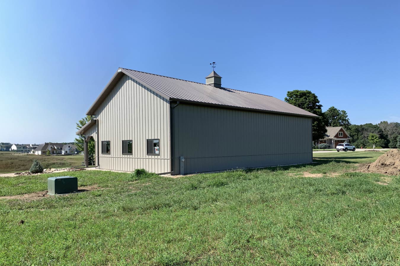 Residential workshop with steel siding, steel roof, Plyco windows, and cupola
