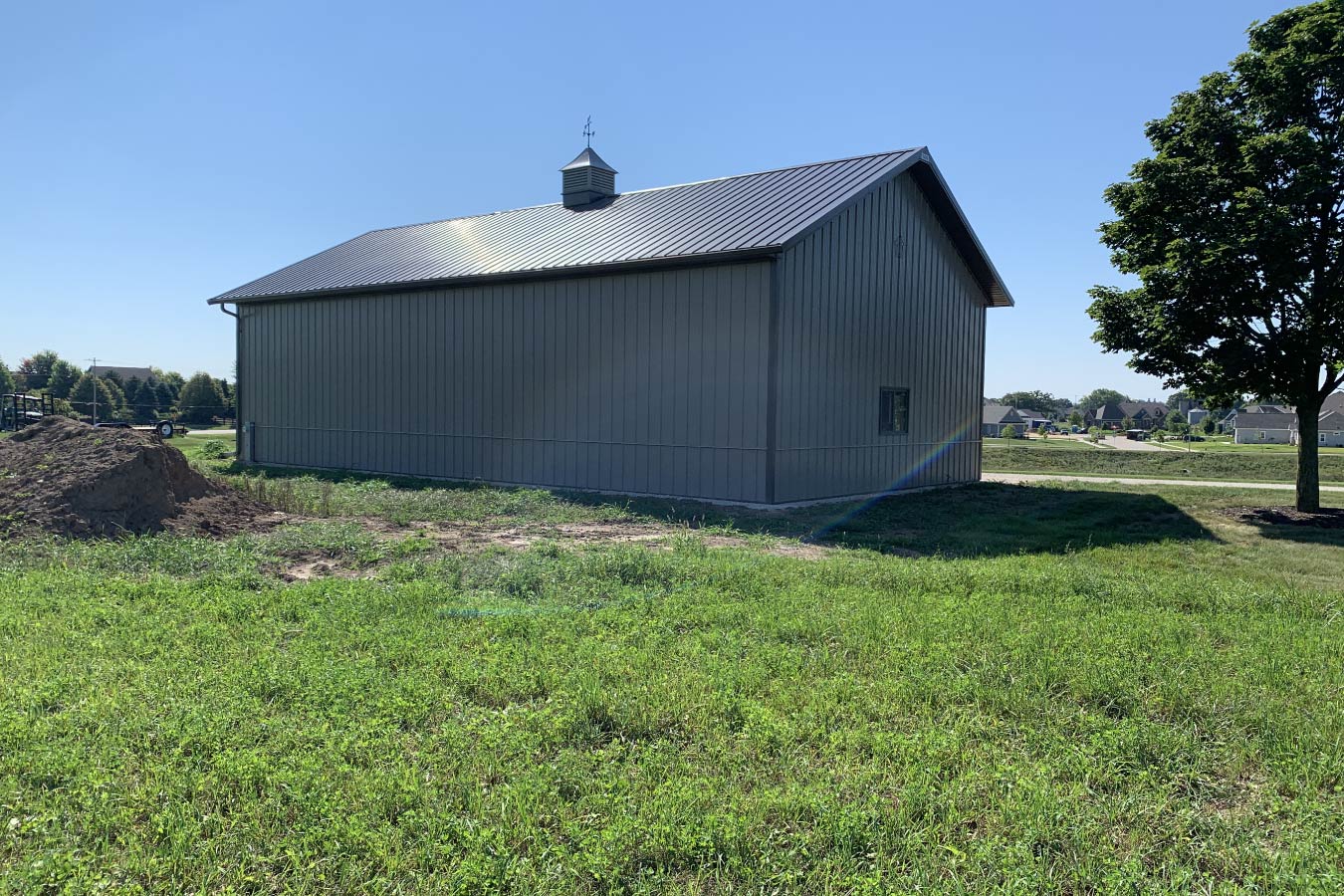 Residential workshop with steel siding, steel roof, minimal windows, and cupola 3'x3' Cupola with Cow Weathervane