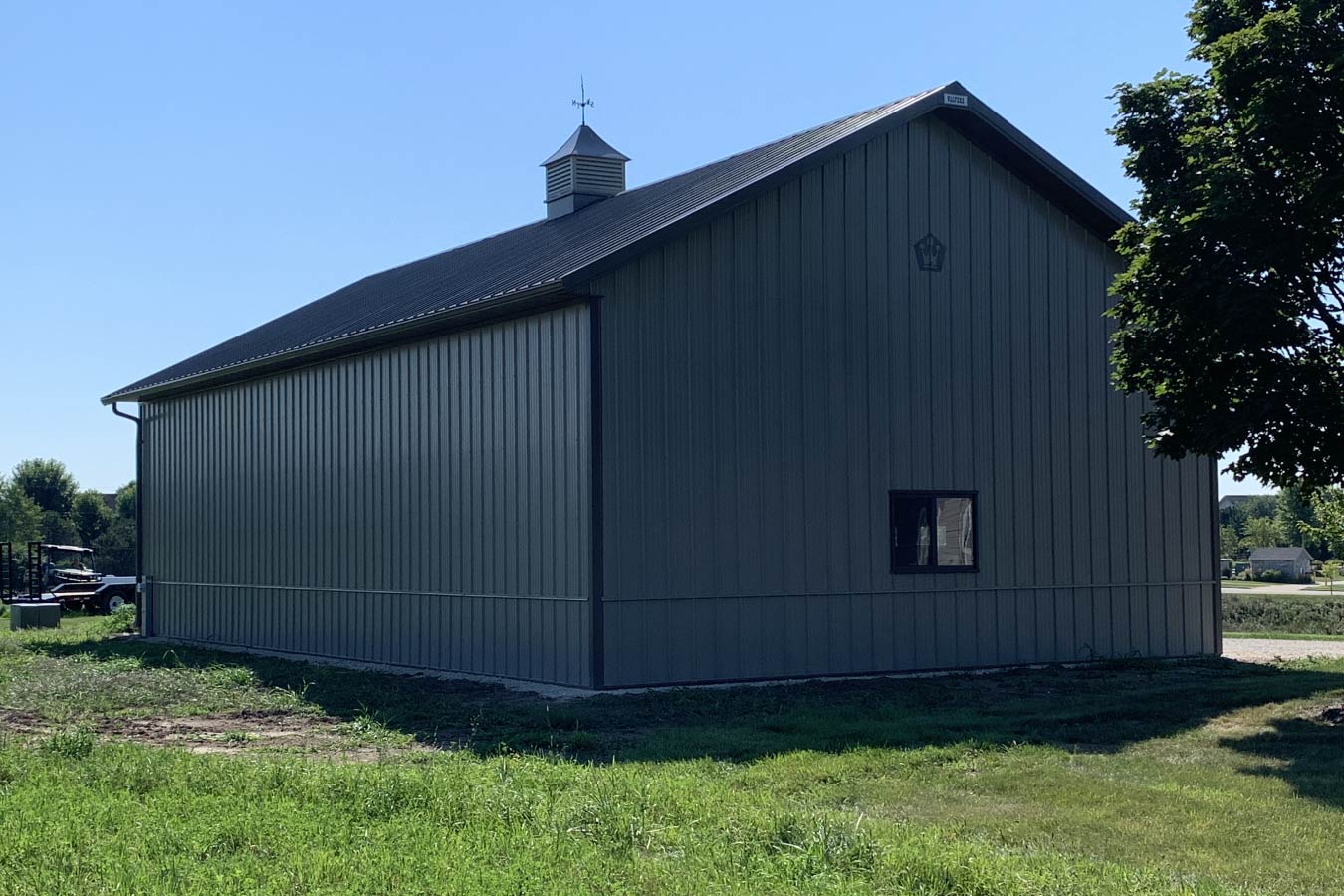 Residential workshop with steel siding, steel roof, single Plyco window, and cupola