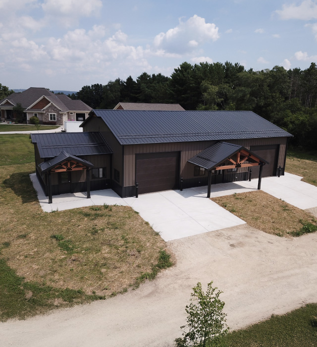 Gable Entrance Building with Dual Cedar Entries and Steel Siding | Walters Buildings Gable entrance building with steel siding, steel roof, dual cedar gable entries, and large overhead door
