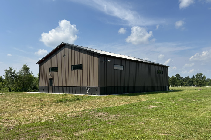 Gable Entrance Building with Steel Siding and Modern Windows | Walters Buildings Gable entrance building with steel siding, steel roof, and horizontal Plyco windows