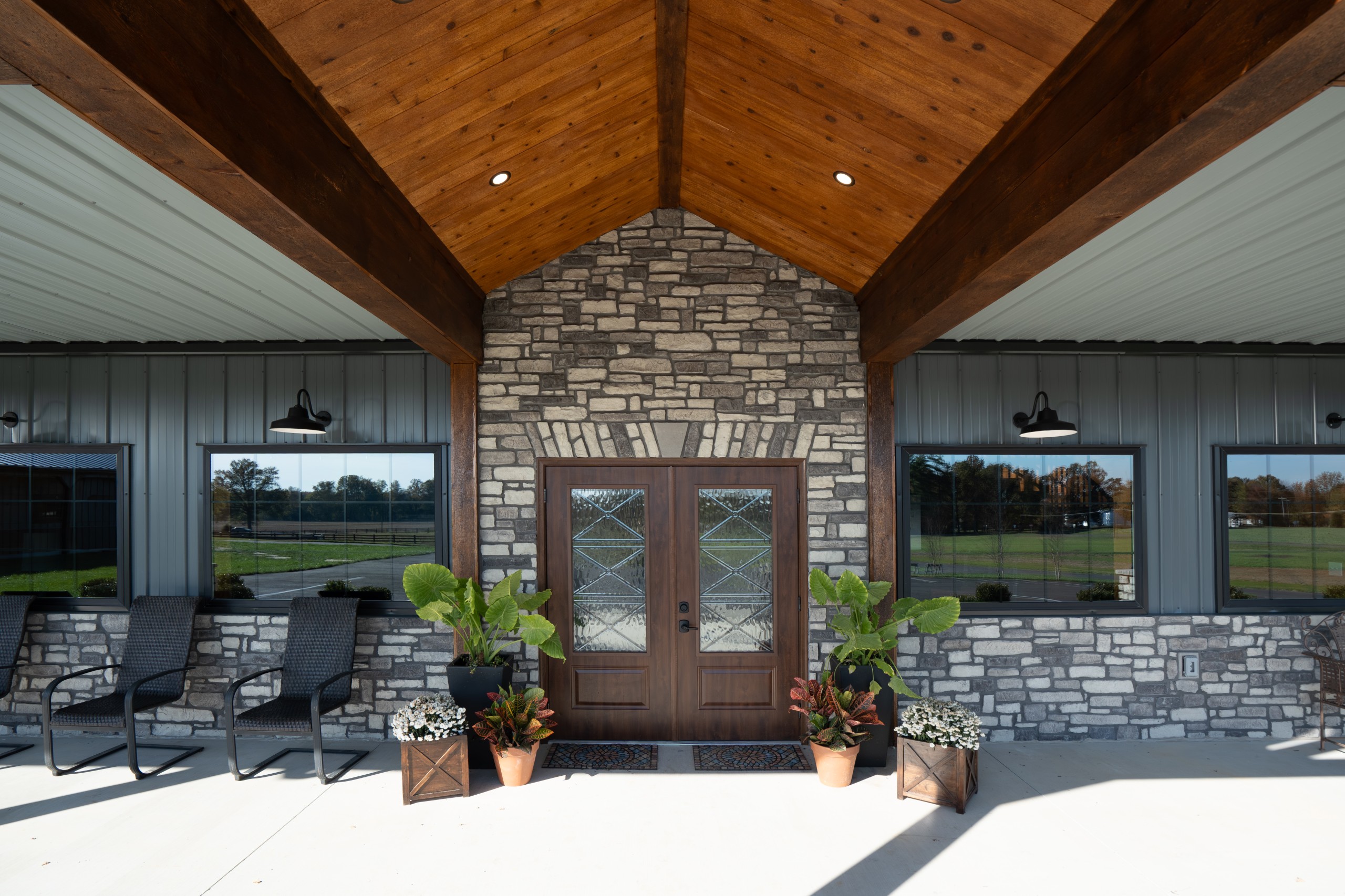 Stone entry and double lobby doors at The Settlement Equestrian Center in Paducah, Kentucky