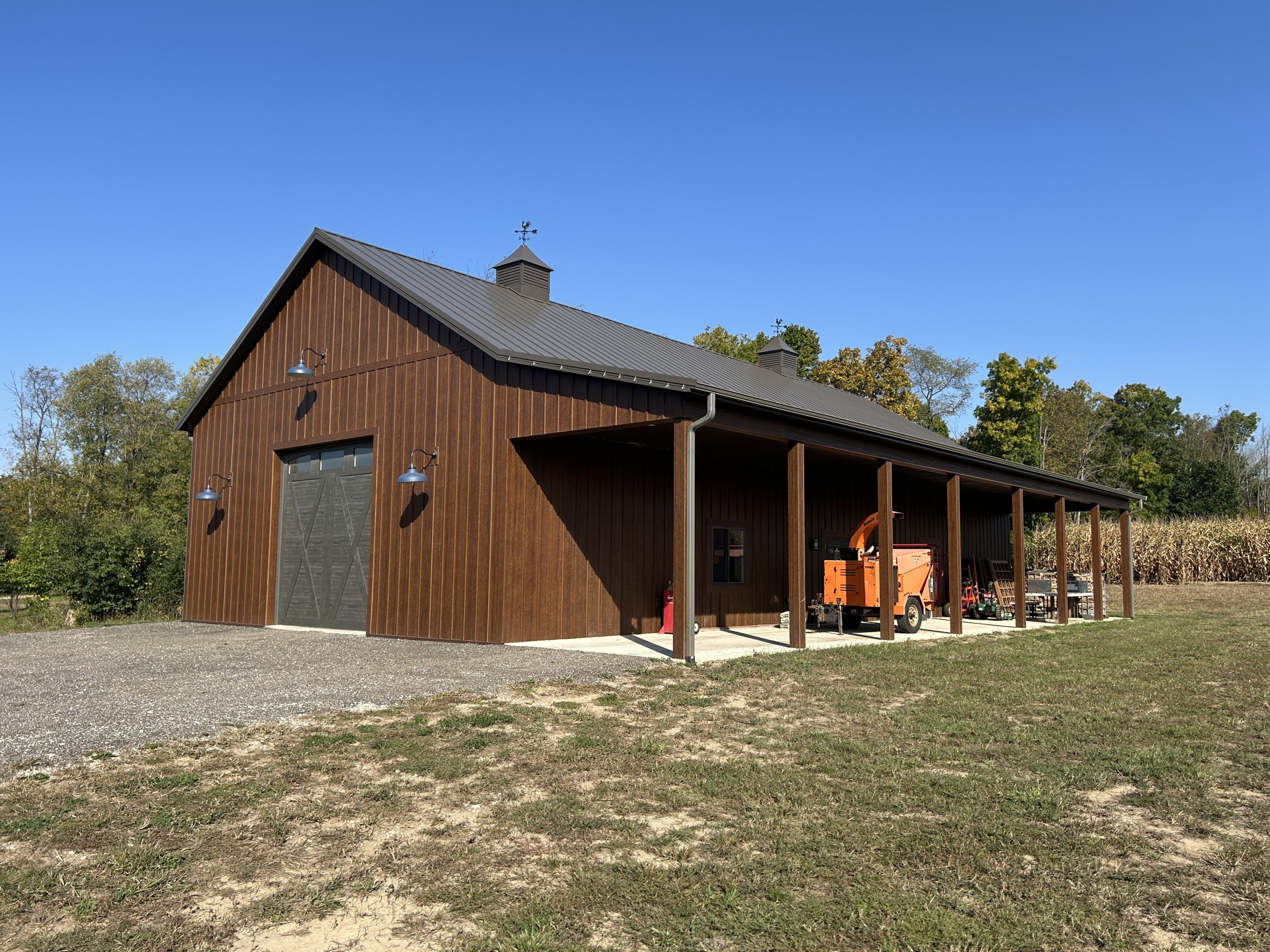 36' x 72' board and batten pole barn with side porch, LP SmartSide siding, and Burnished Slate roof