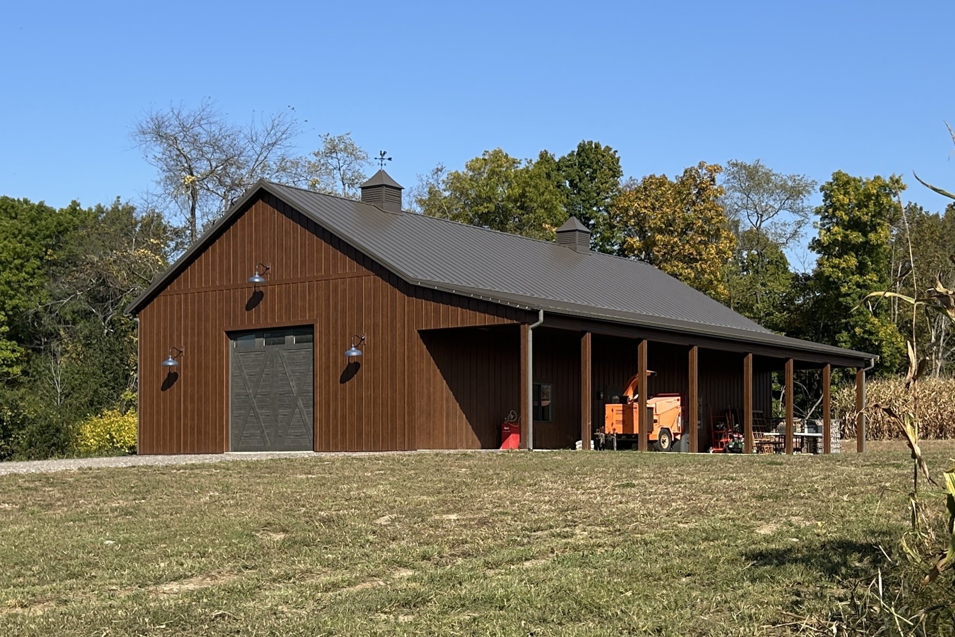 36′ x 72′ Board and Batten Pole Barn with Burnished Slate Roof 36' x 72' board and batten pole barn with LP SmartSide siding, Burnished Slate roof, and side porch