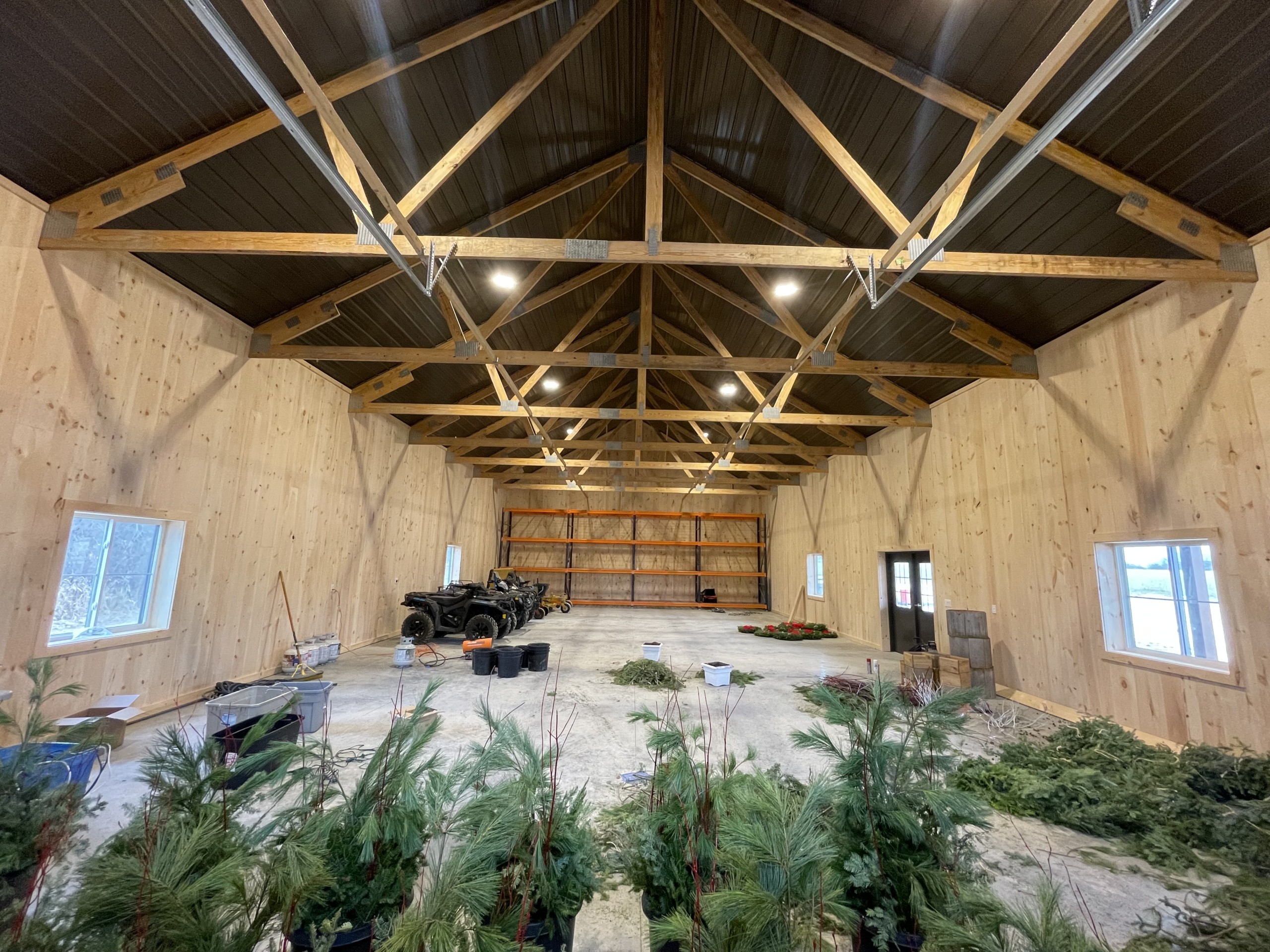 36′ x 72′ Board and Batten Pole Barn Interior Interior of a 36' x 72' board and batten pole barn with rough-sawn pine walls and Burnished Slate steel between trusses