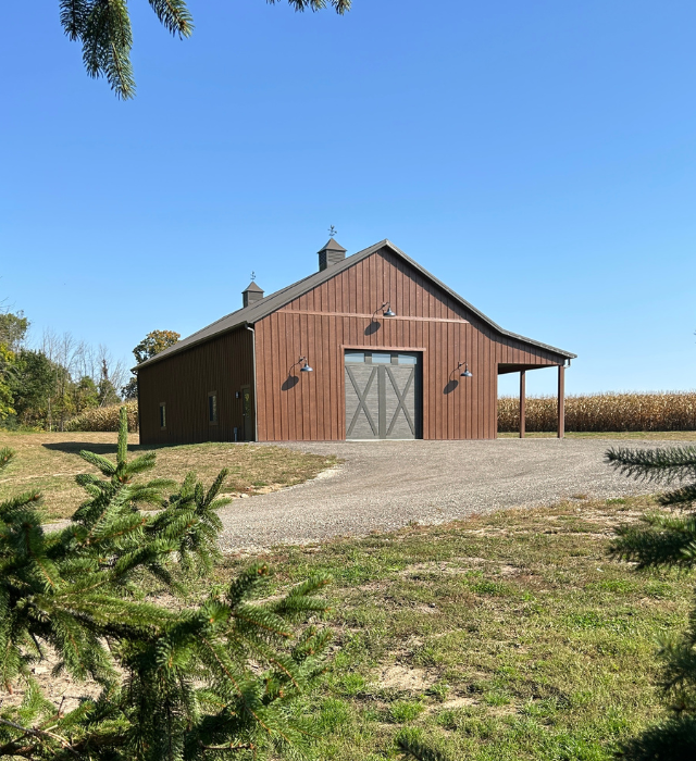 Board and Batten Pole Barn Exterior | Walters Buildings 36' x 72' Board and batten pole barn with vertical siding and cupolas