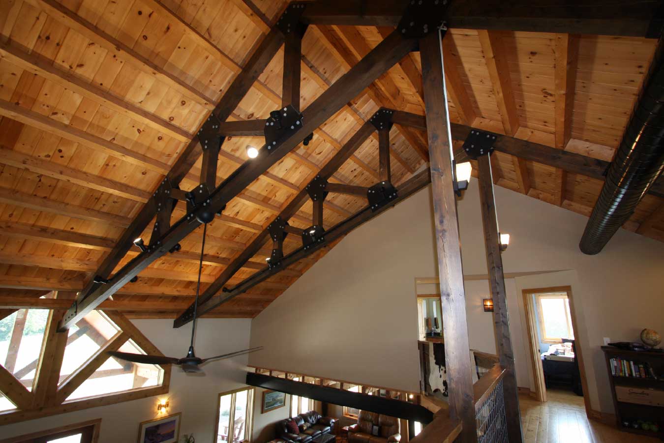 Exposed trusses in luxury timber frame home.