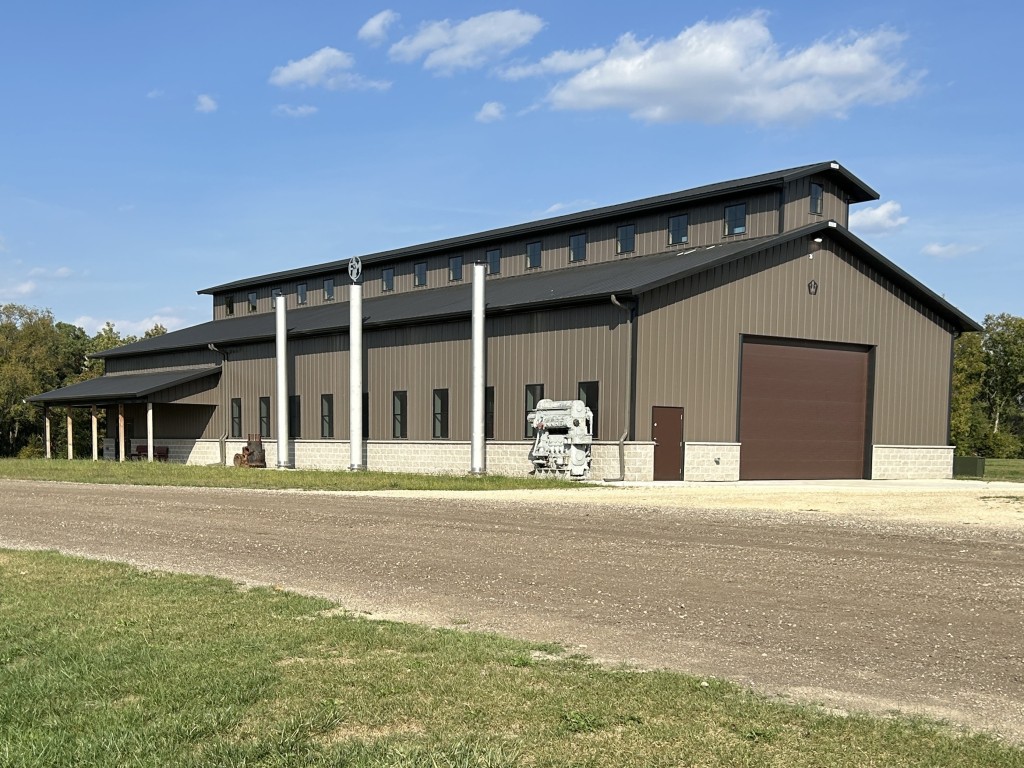Completed Baer Powerhouse at Rock River Thresheree, a monitor-style commercial post-frame building built to match the original architectural rendering.