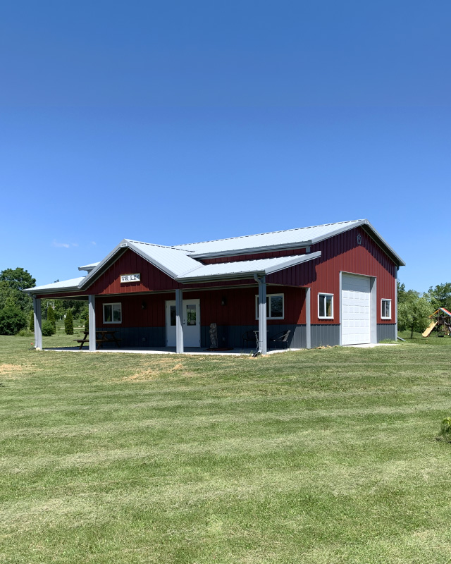 30×40 Pole Barn Garage with Covered Porch | Red Hobby Garage | Walters Buildings 30x40 red pole barn hobby garage with covered porch white steel roof and wainscot siding